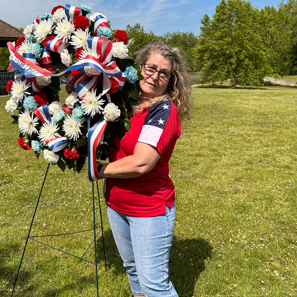 Maria Escalante presenting flowers at the Eatontown Memorial Day Observance.